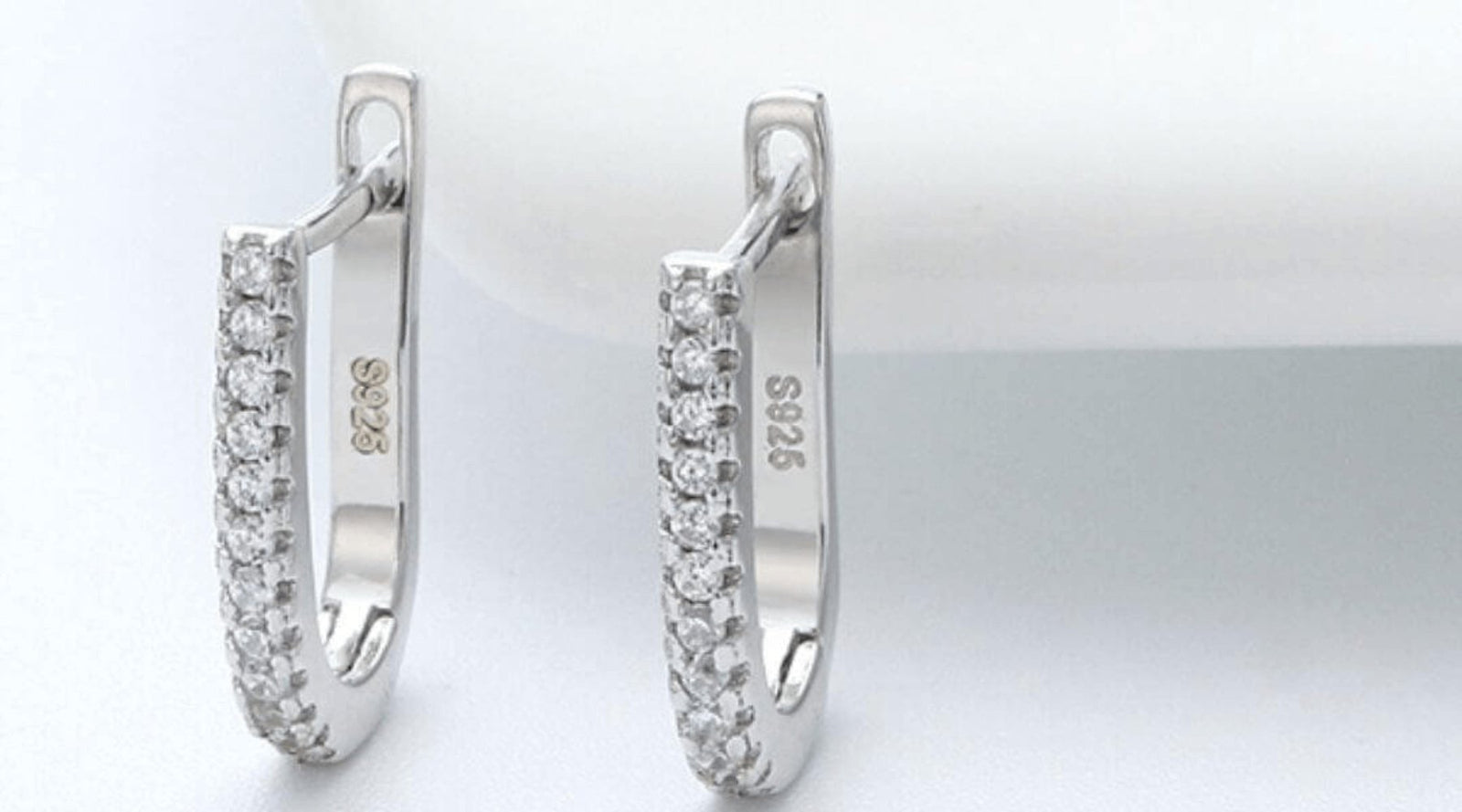 White gold oval hoop earrings