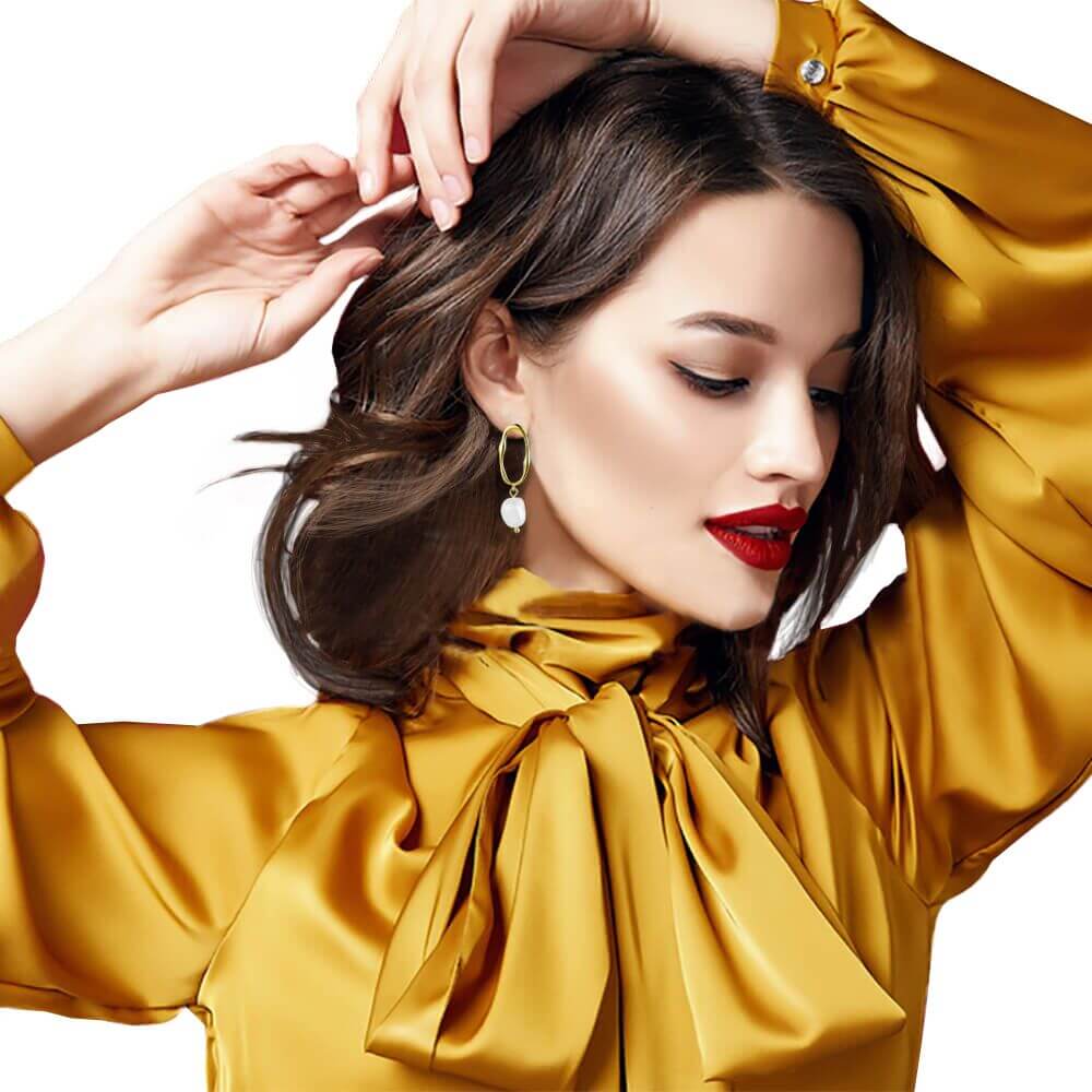 925 Sterling Silver Pearl Earrings shown on a model with brown hair preparing for a party- BELLE DE SOIREE earrings Devon