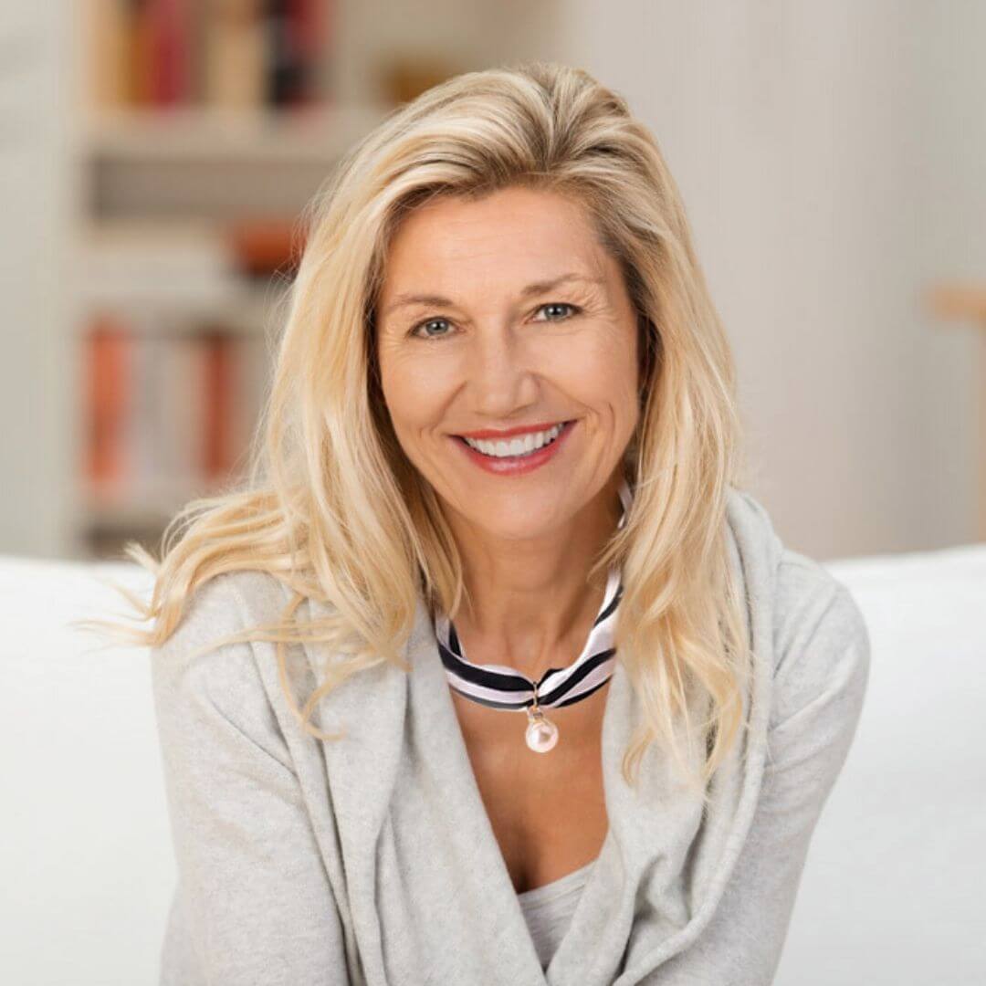 A woman wearing a grey sweater and a black and white bandana choker necklace with crystal accents and a pearl dangling motif-BELLEDESOIREE