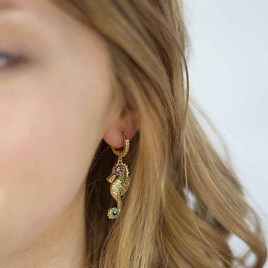 Sea horse Gold Zircon Drop earrings shown on a model- belledesoiree