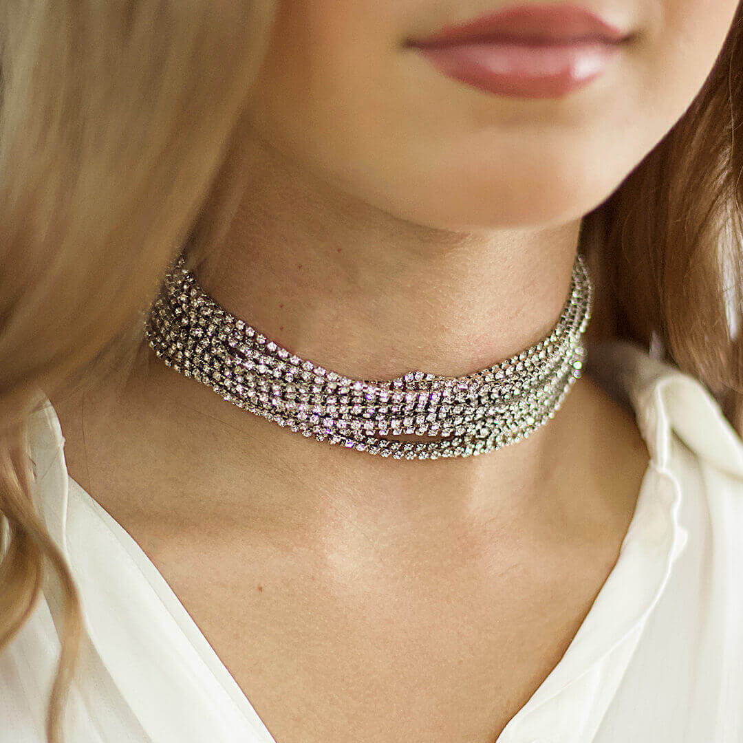 Close-up of a woman wearing a sparkling choker necklace.-Belle de Soiree
