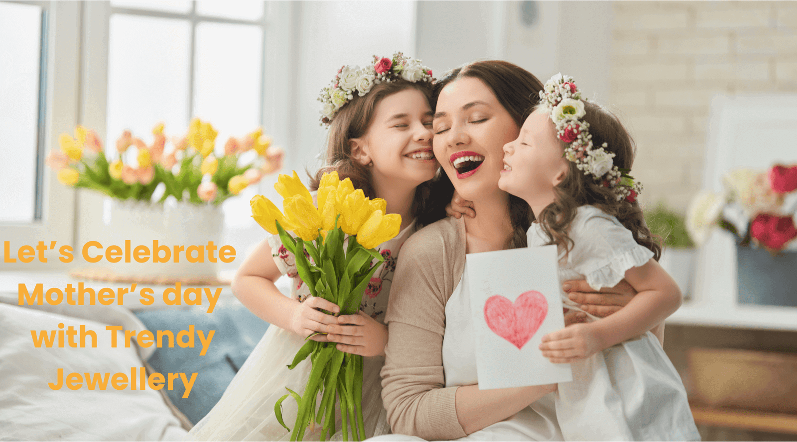 Mother and two daughters celebrating Mother's Day with flowers and a card.