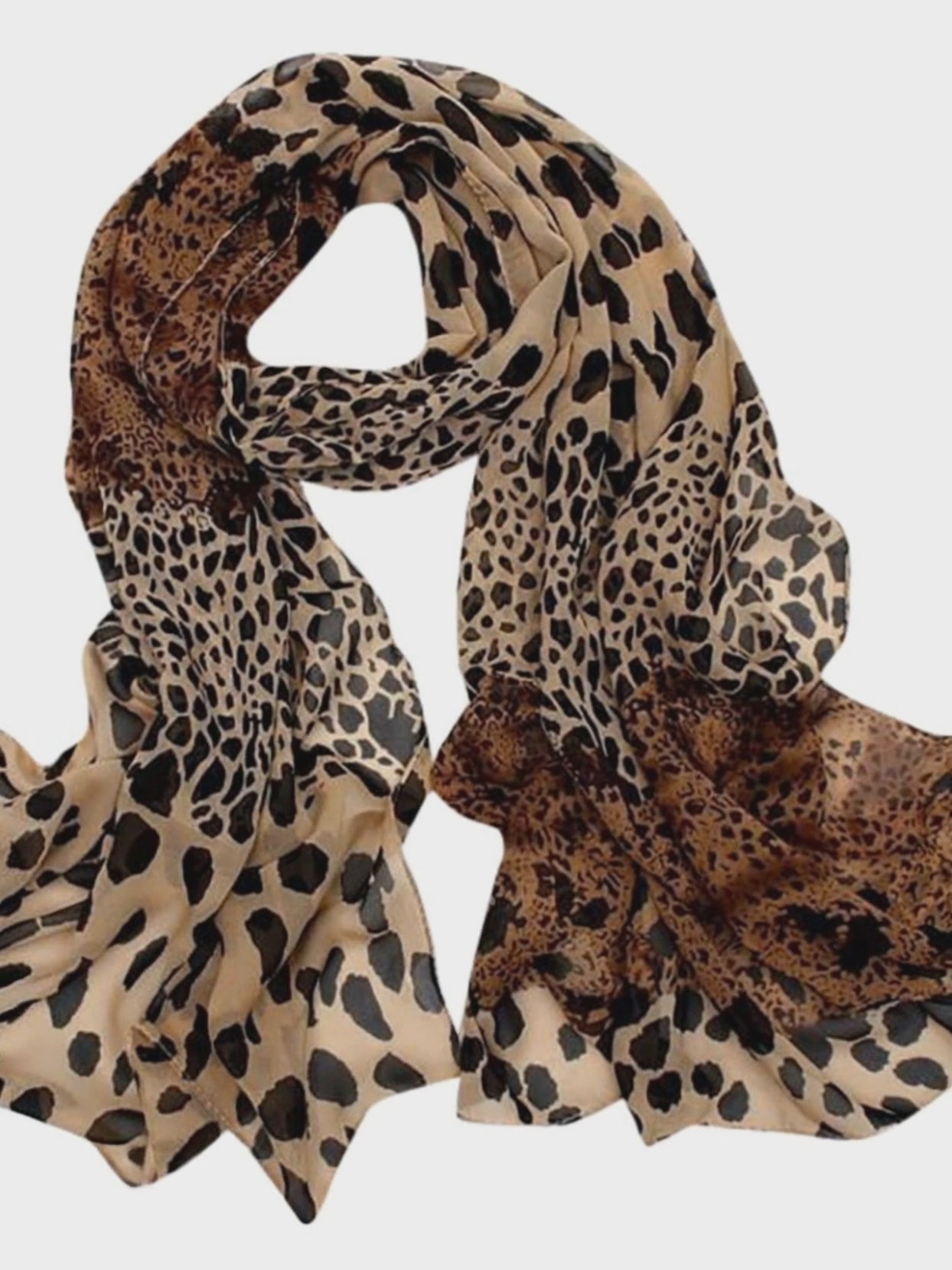 presentation of the scarf worn by a woman dressed with a black trousers and black jacket in a funny way- belle de soiree