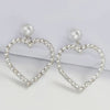 Diamante Big Heart Earrings worn by a model walking the catwalk-belle de soiree