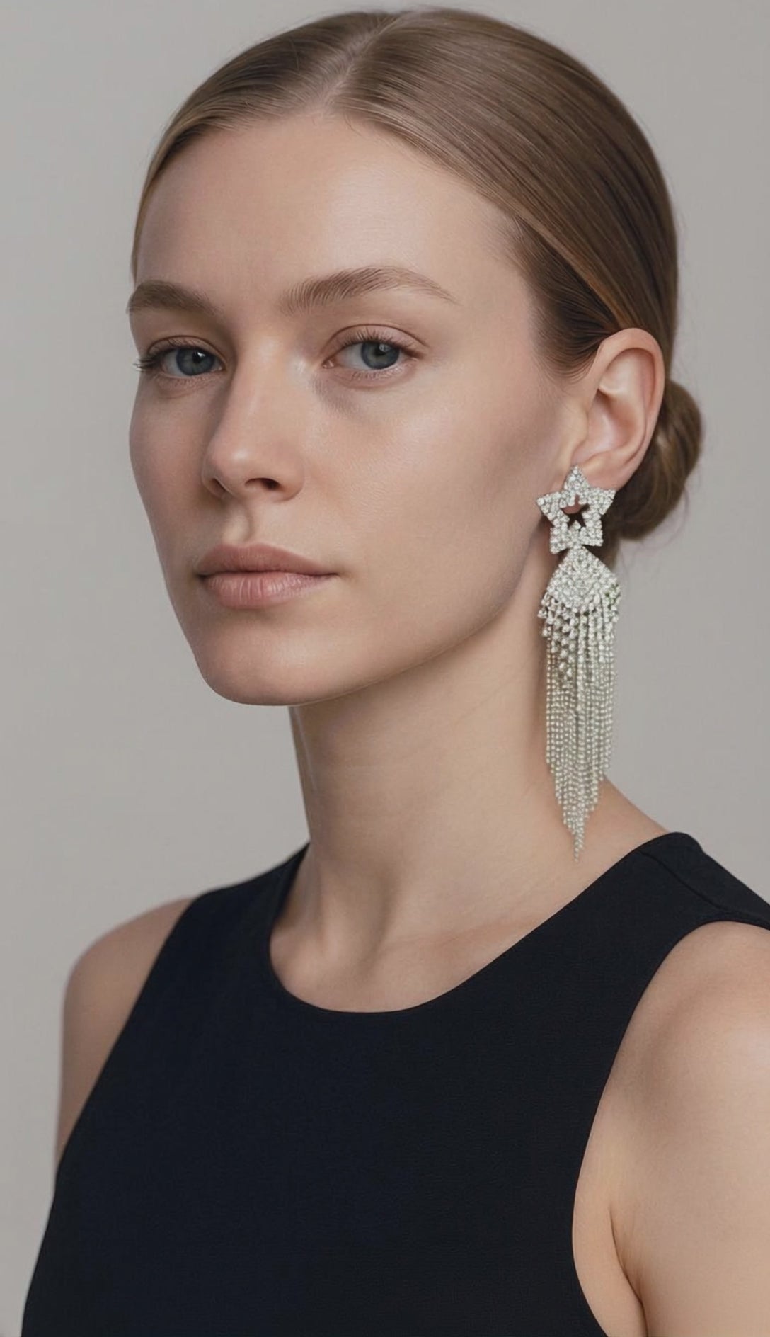 dangling long earrings worn on a brunette-belle de soiree