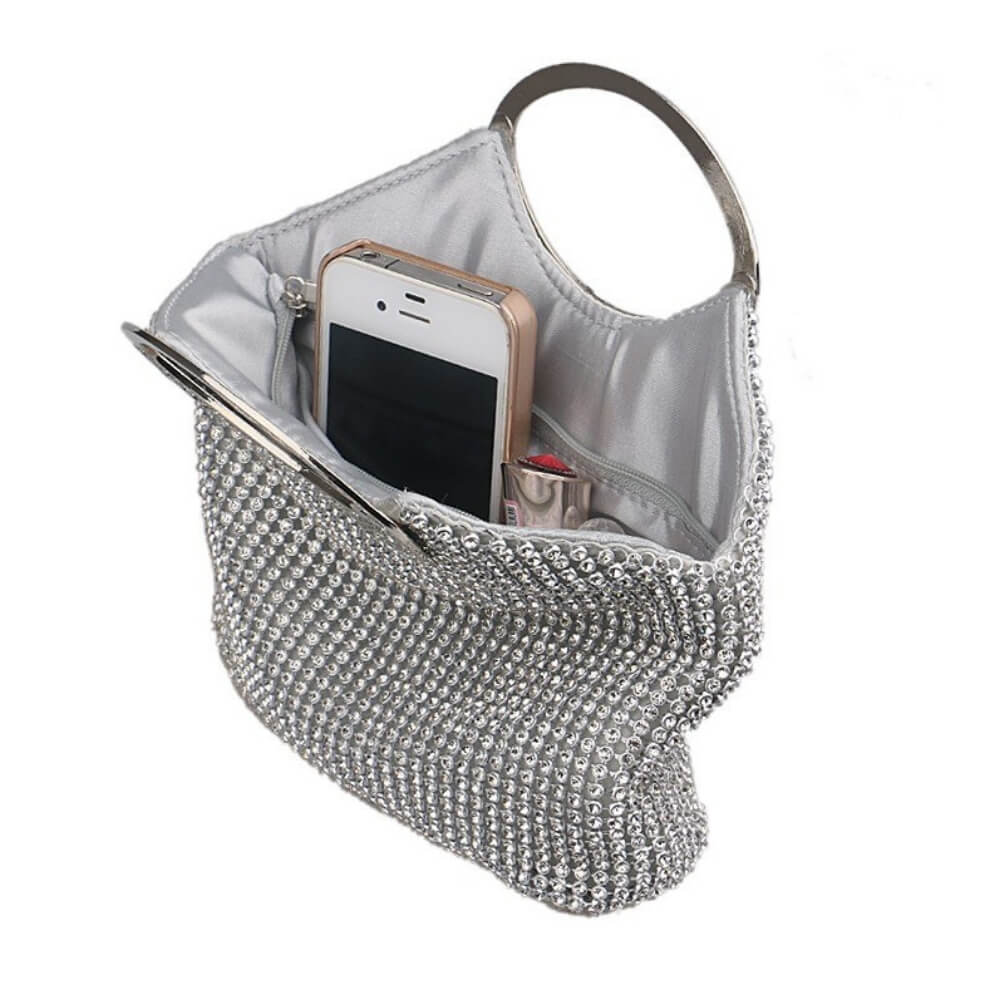The Bucket Luxurious Evening Bag Anna is shown open. It shows you can insert many personal items. The bag has 2 handles- belledesoiree Anna bucket rhinestones bag