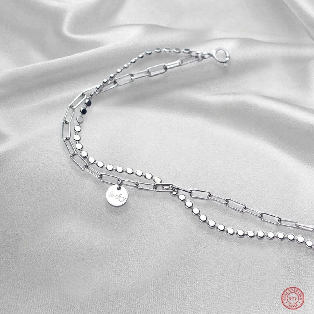  Layered Silver Chain Bracelet Alyssa presented on a luxury silk grey material- BELLE DE SOIREE Alyssa layered bracelet