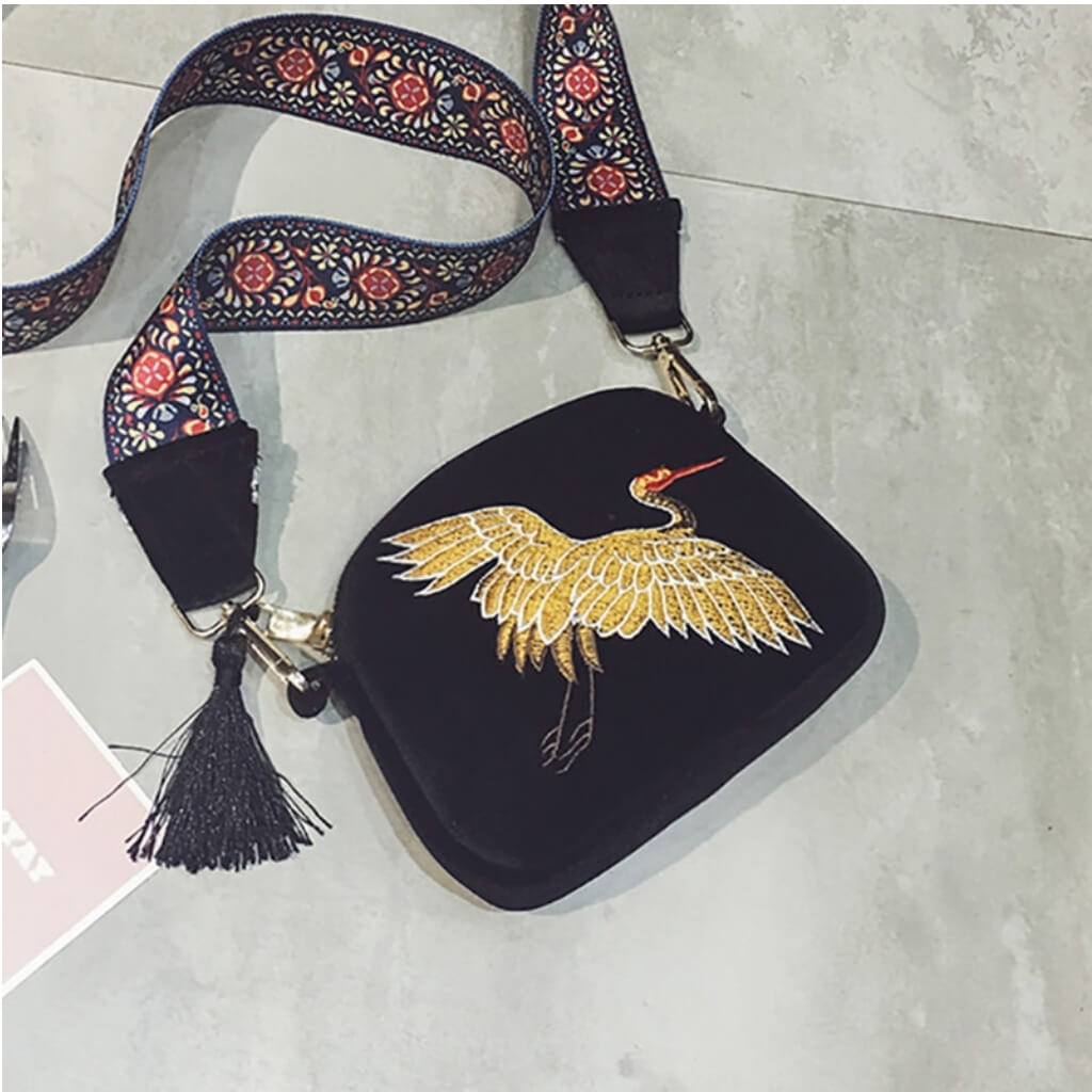 Belledesoiree presents an embroidered bird on a velvet bag with tassels- belle de soiree
