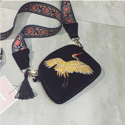 belledesoiree presents an embroidered bird on a velvet bag with tassles