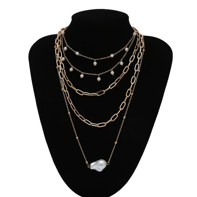 Gold Layered Necklaces with pearls shown on a black display-BELLEDESOIREE Boho Gold Layered Necklaces
