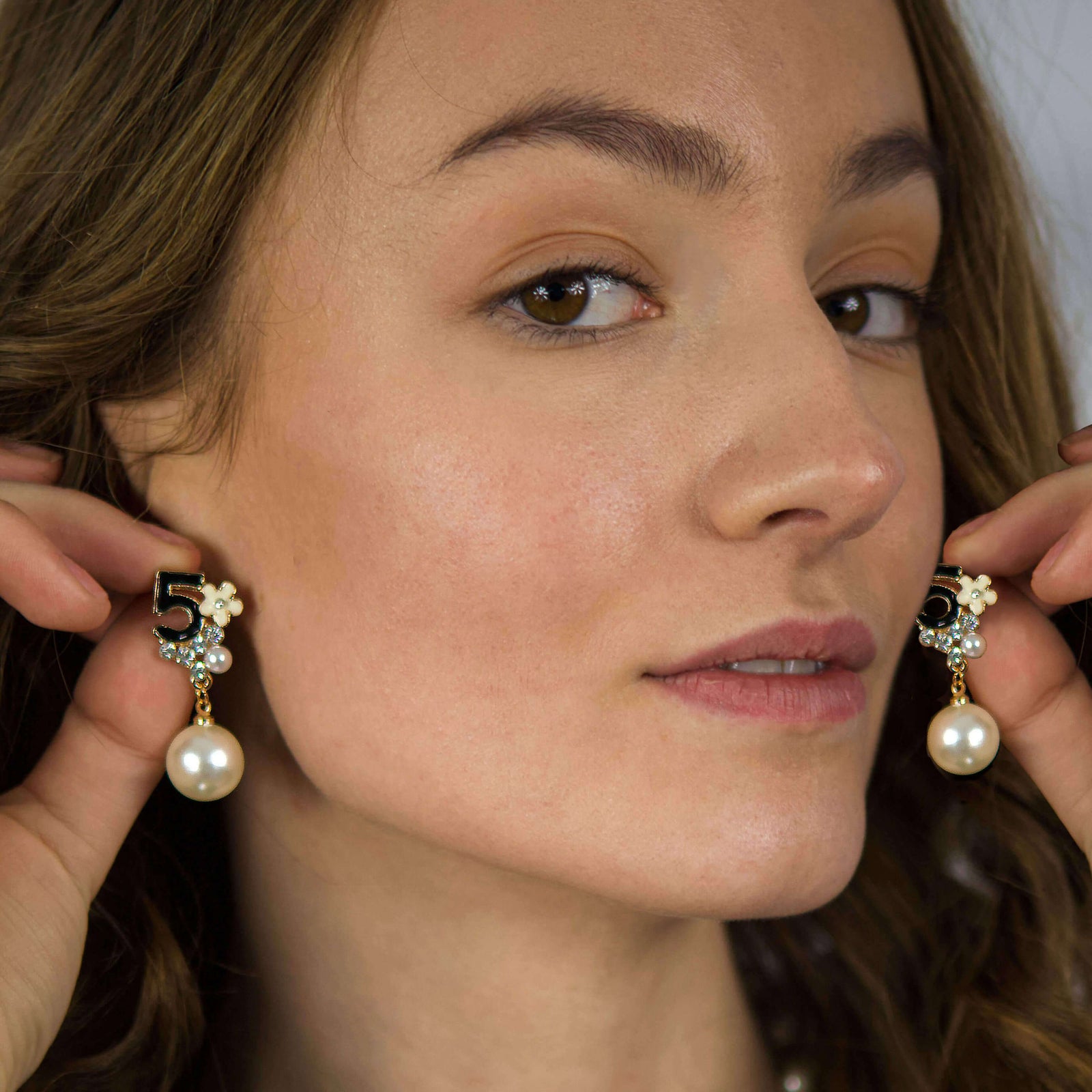 Earrings with Pearls shown on a model with brown hair- BELLE DE SOIREE IRINA earrings with matching necklace