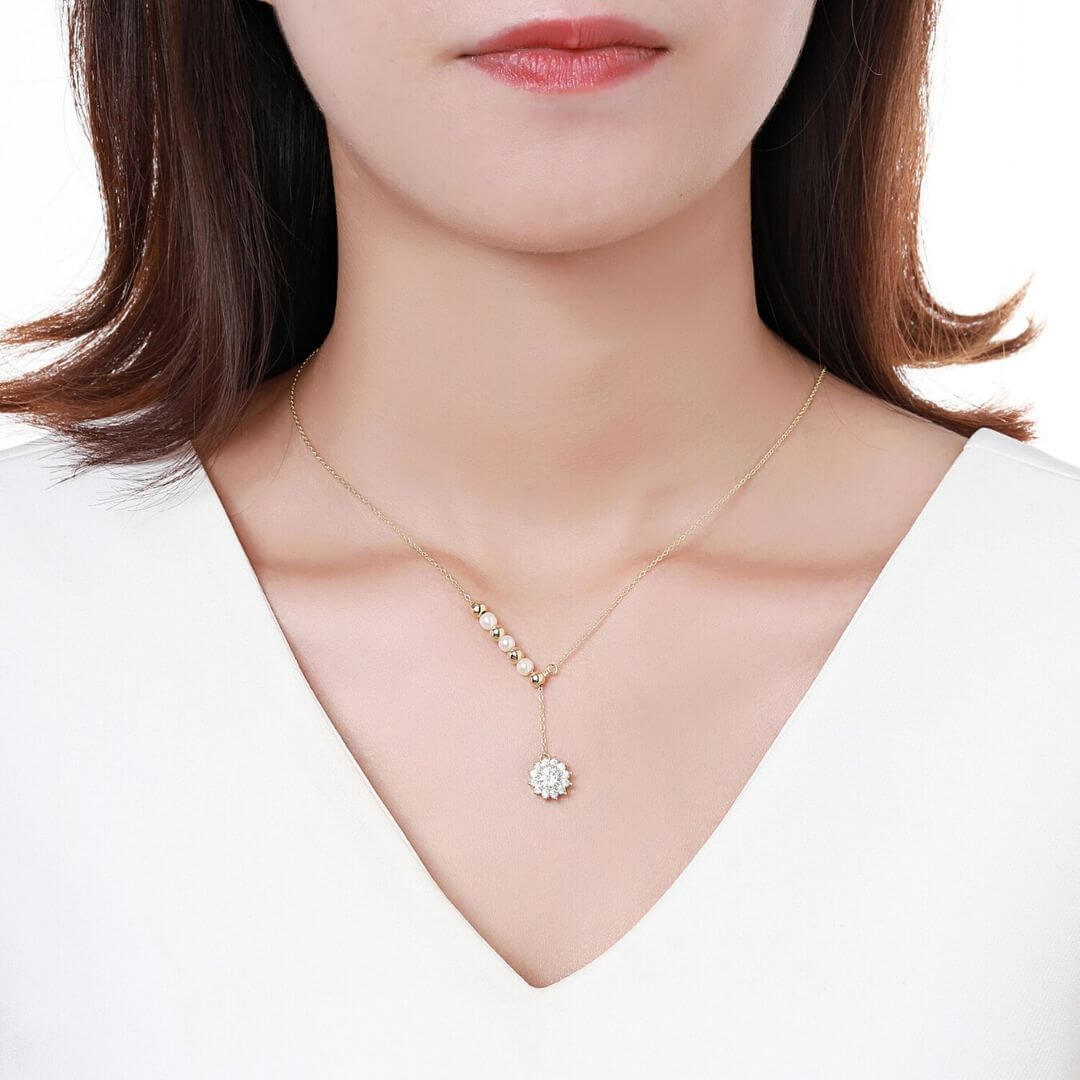 Gold Cubic Zircon Pave Pendant Necklace  shown on a model with brown hair and a white T shirt-BELLE DE SOIREE Roxana