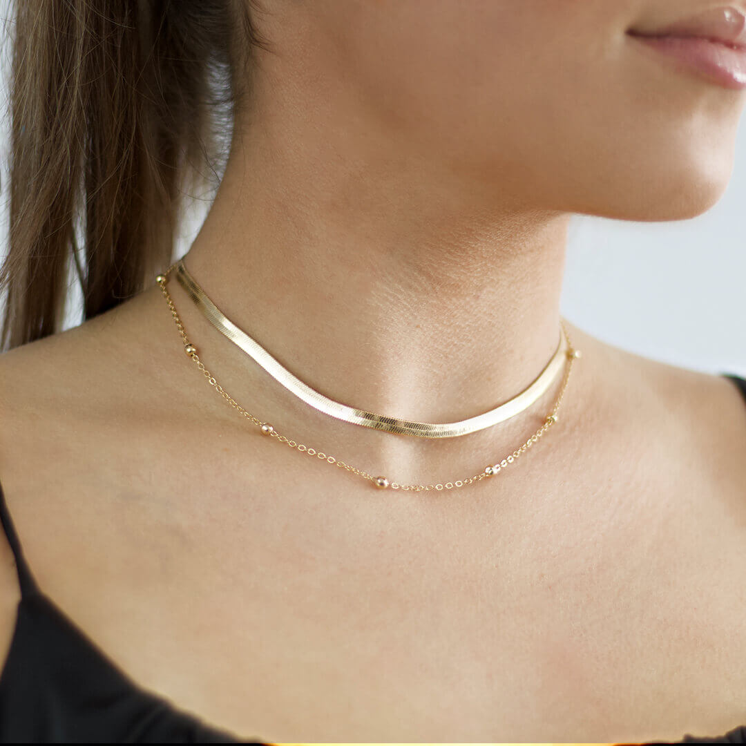  Layered Chain Necklace shown on a model with brown hair- BELLE DE SOIREE Golden Layered Chain Necklaces 2