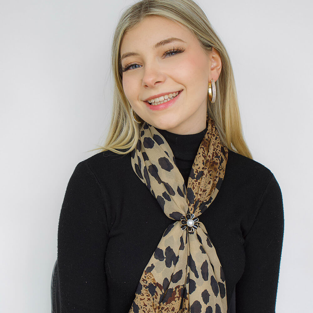 Leopard Print Scarf on a blond woman with a black flower broche to keep it nice-belle de soiree