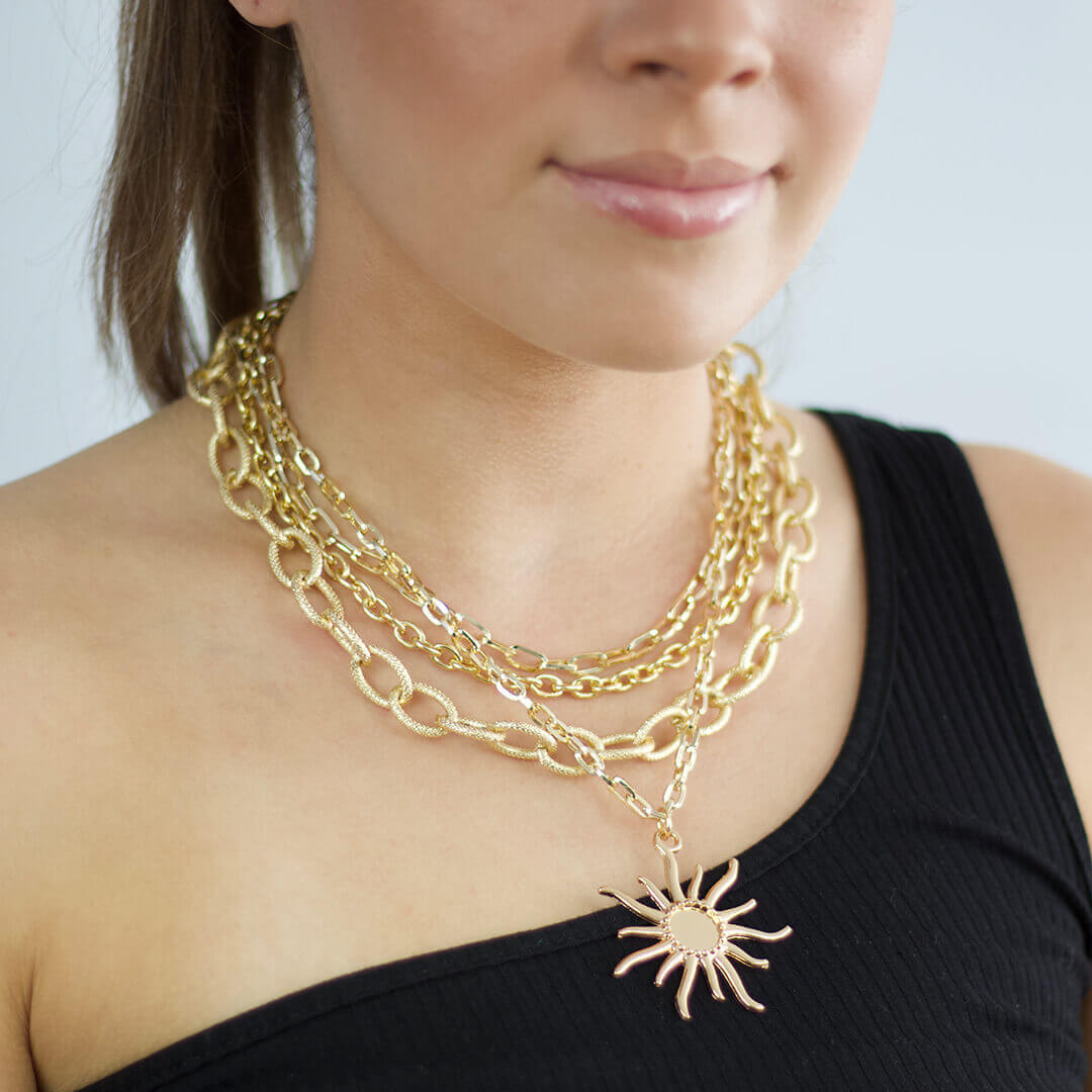 Vintage Layered Necklace with a Star shown on a model wearing a black top- BELLE DE SOIREE Layered Necklace with a Star