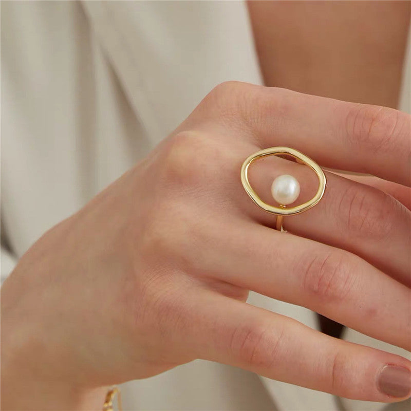 Simple gold pearl on sale ring